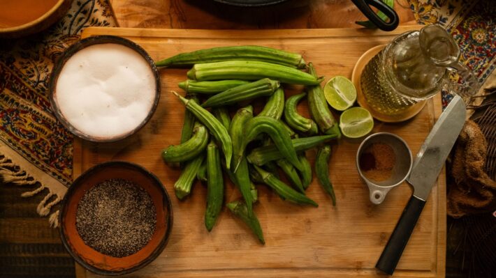 Fresh green okra on a cutting board