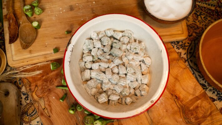 Okra covered in flour before frying