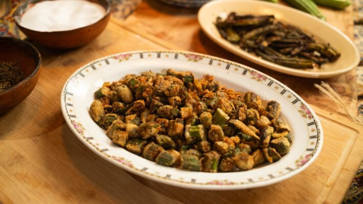 An oval plate filled with freshly fried okra
