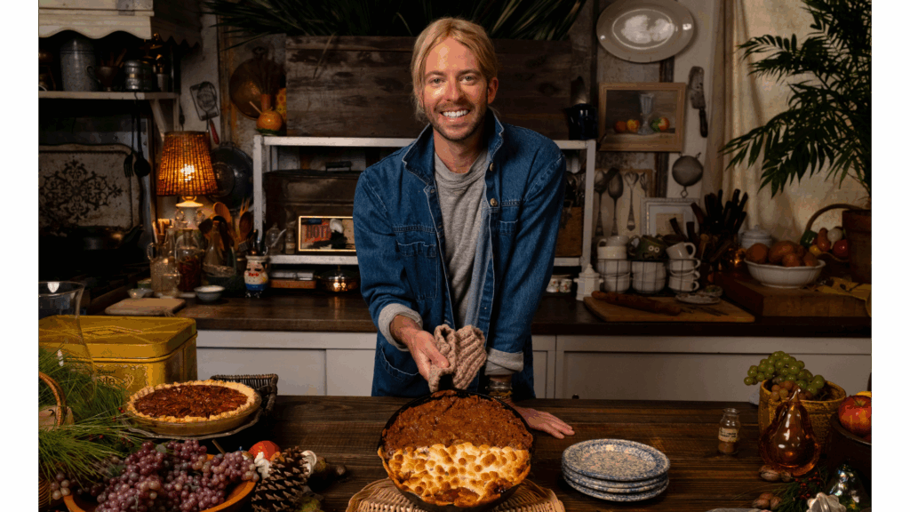 Garden Party host Trace Barnett showcasing his Sweet Potato Casserole in a cast iron skillet