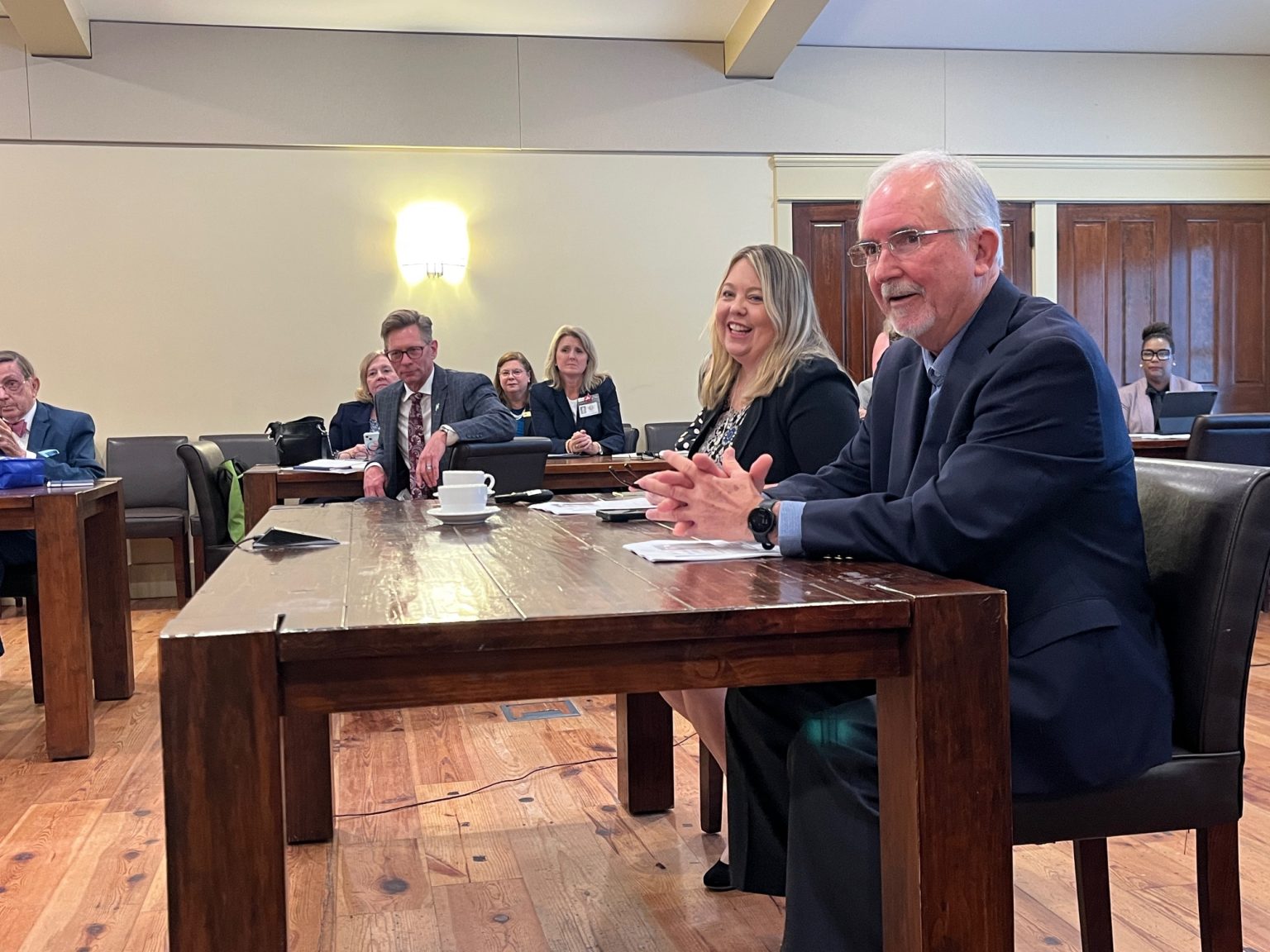 Mobile County Schools Communication Director Rena Havner Philips and Board Member Don Stringfellow speak to the Alabama Board of Education in Mobile, Ala., on Jan. 8, 2026. (Trisha Crain | Alabama Daily News)